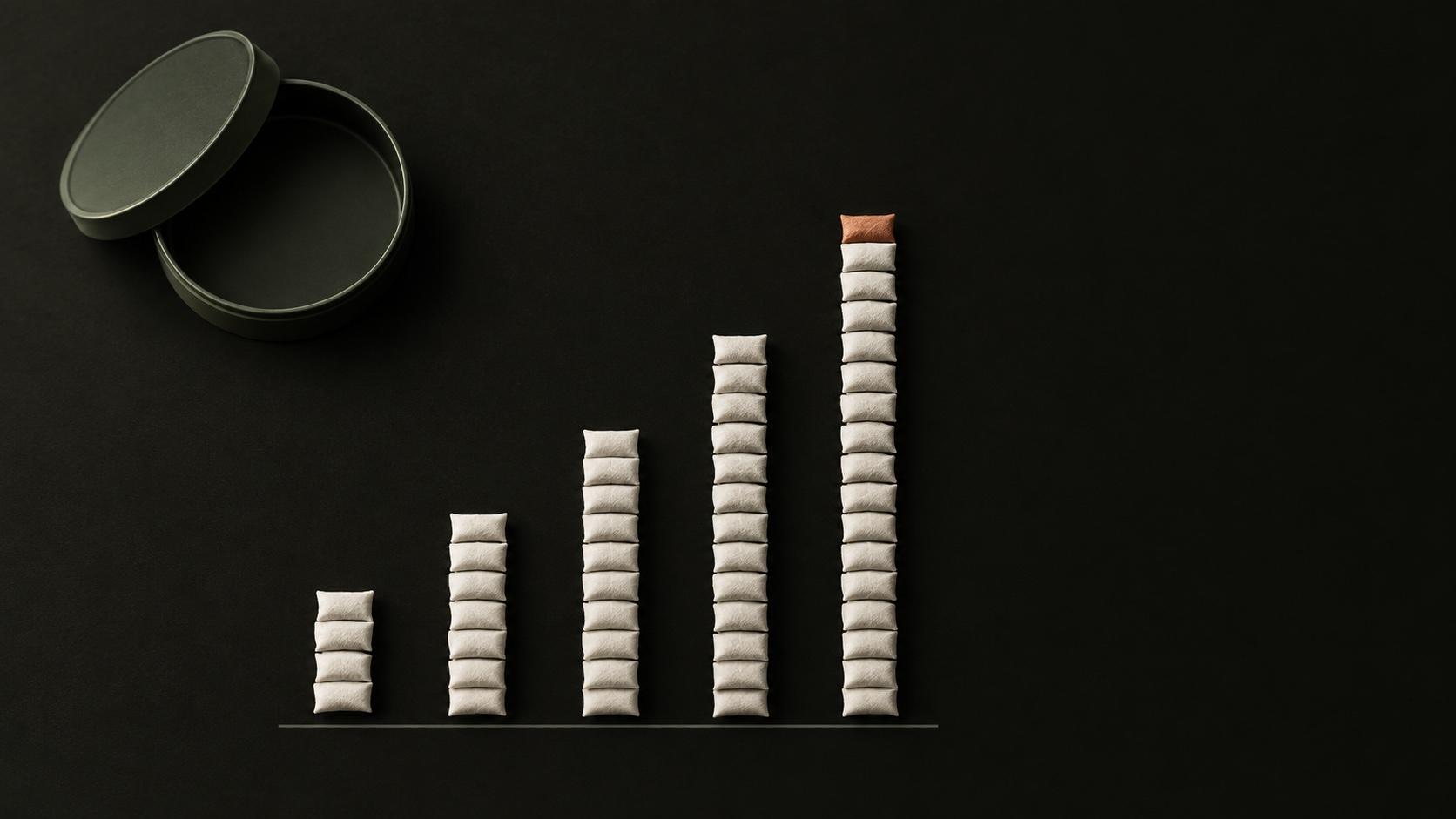 How many Zyn a day adds up to: nicotine pouches stacked into five rising columns beside an open can